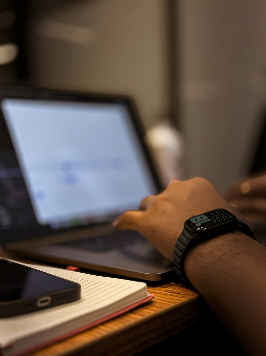 person coding on laptop