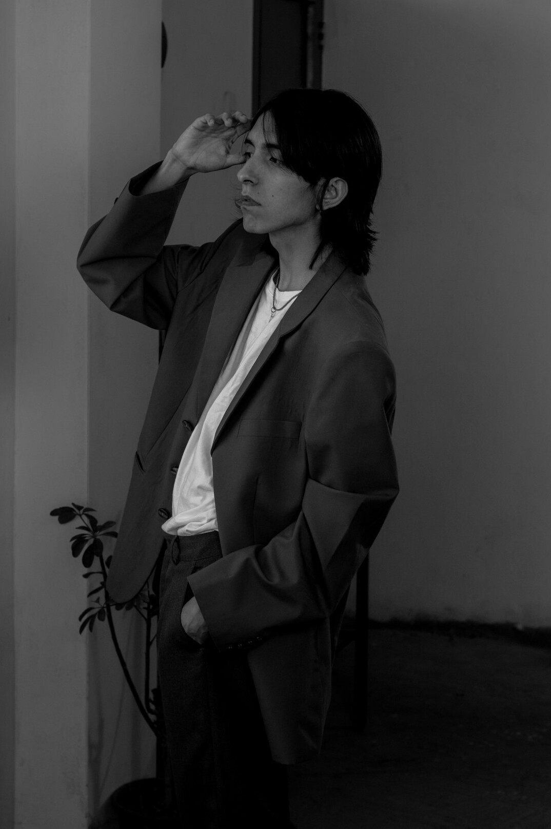 Studio portrait of a young woman with short hair and a blazer