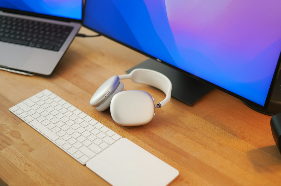 Developer building a website on a dual monitor setup