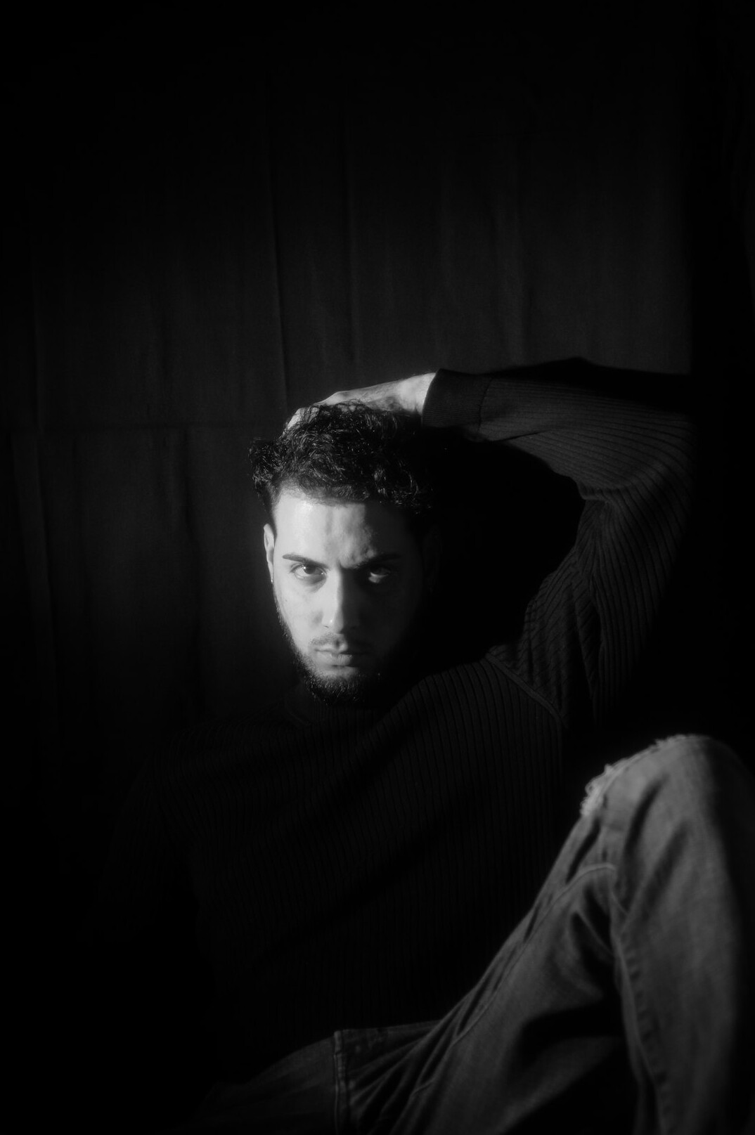 Studio portrait of a middle-aged man with short hair in a sweater