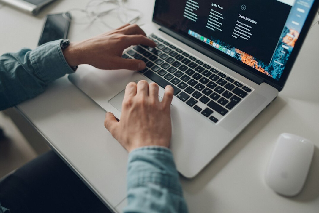 person learning programming on laptop