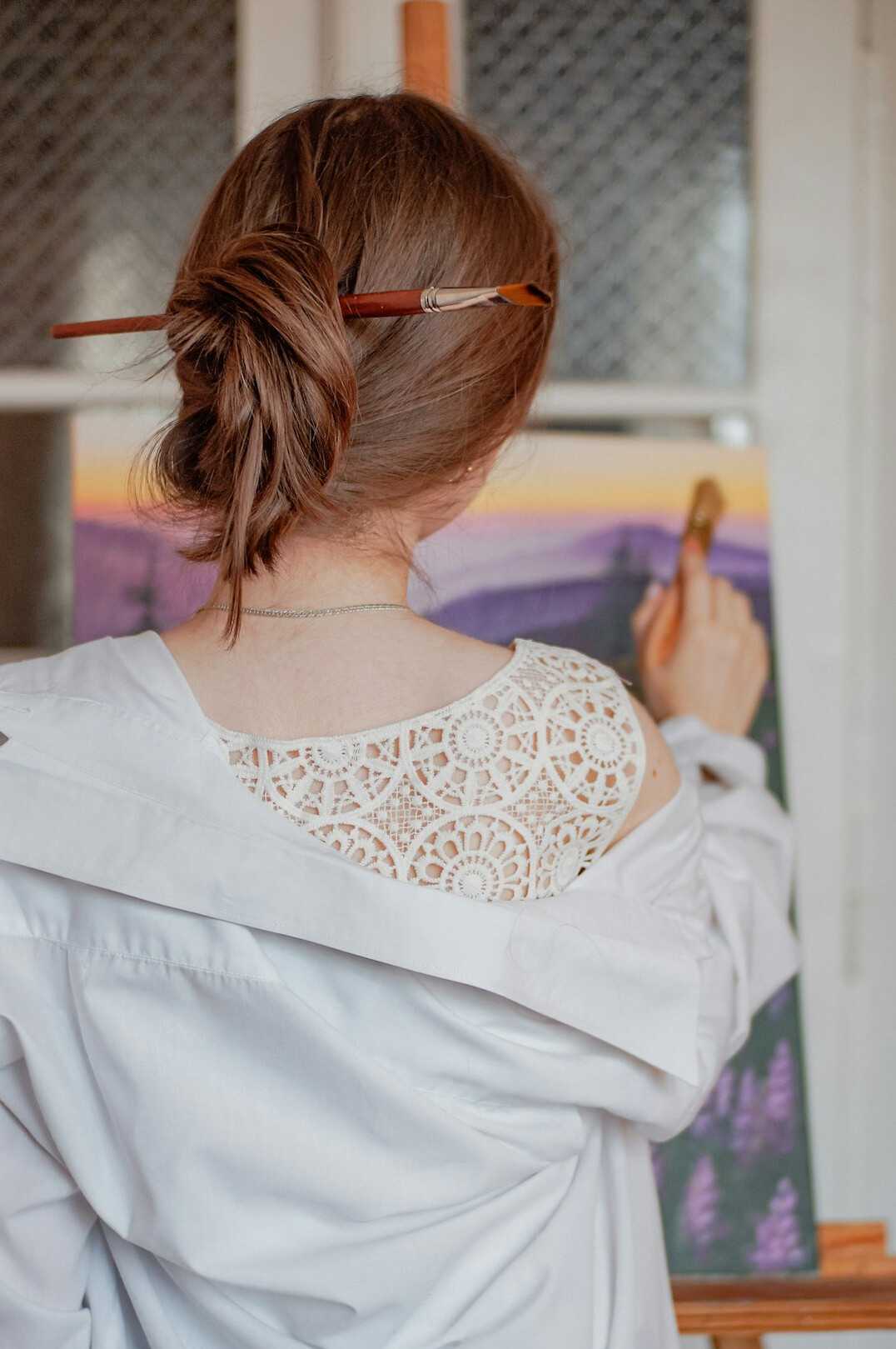 Young woman explaining an algorithm flowchart on a whiteboard