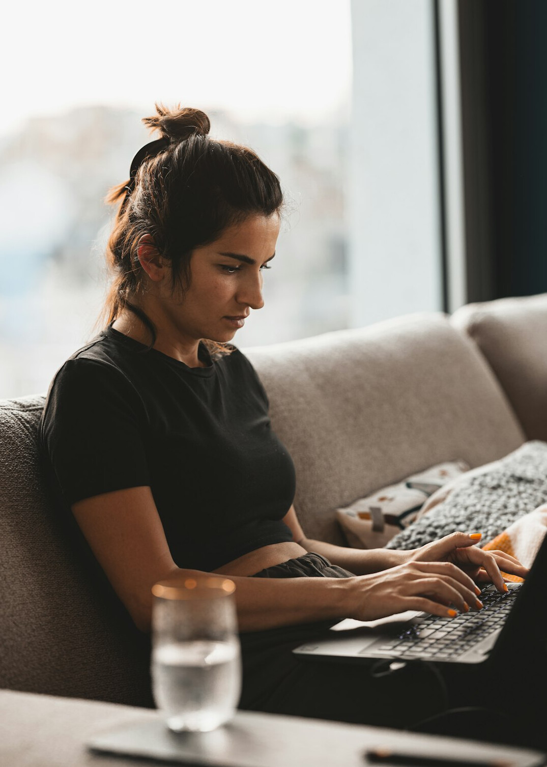 woman coding on laptop